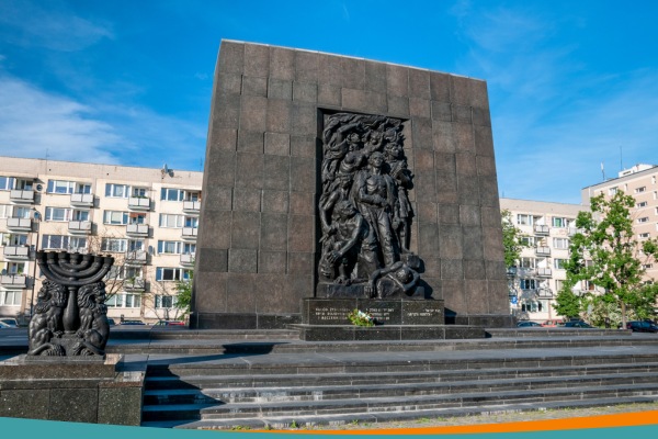 Monument to the Ghetto Heroes in Warsaw, a bronze relief depicting fighters of the 1943 Warsaw Ghetto Uprising, with a menorah sculpture to the left